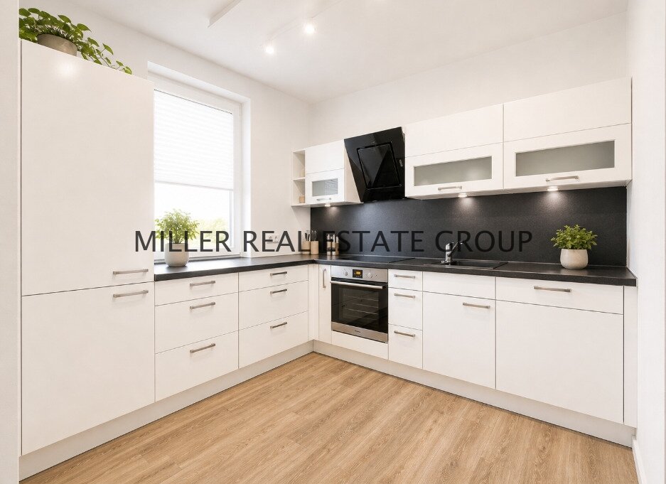 Moderne 4-Zimmer-Erdgeschosswohnung mit Privatgarten, Terrasse & zwei Tiefgaragenstellplätzen!